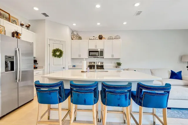 a view of a livingroom with furniture and a flat screen tv