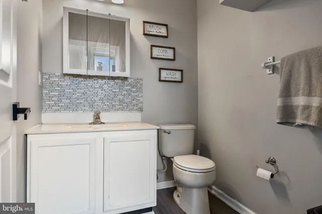 a bedroom with a bed and a mirror