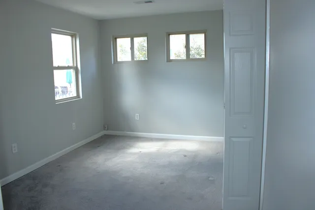 an empty room that has a window in it