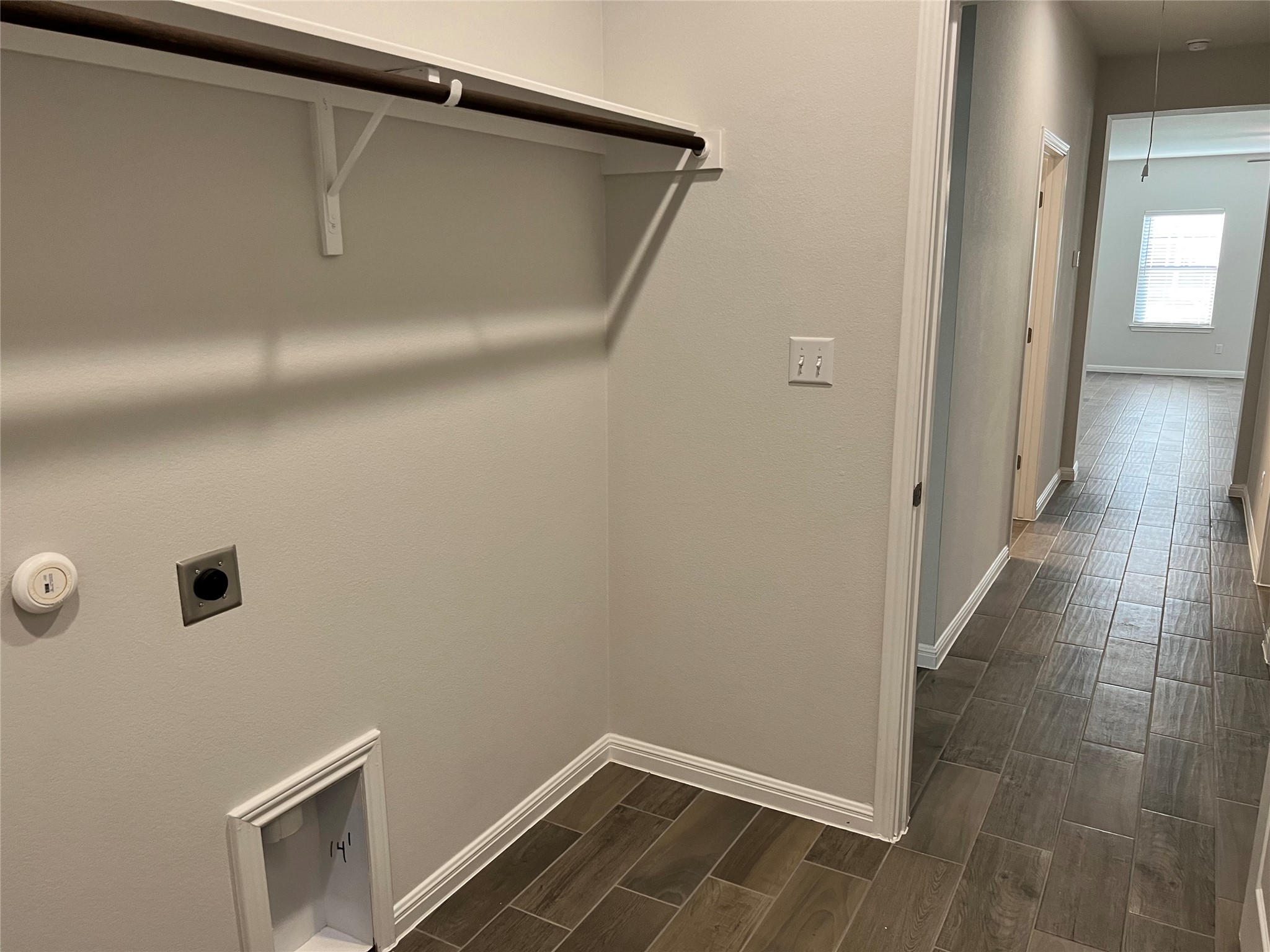 140 Pentro Path Georgetown, TX 78626 - Photo 15 of 37 Functional laundry space with a convenient hanging rod and easy access to utility connections.