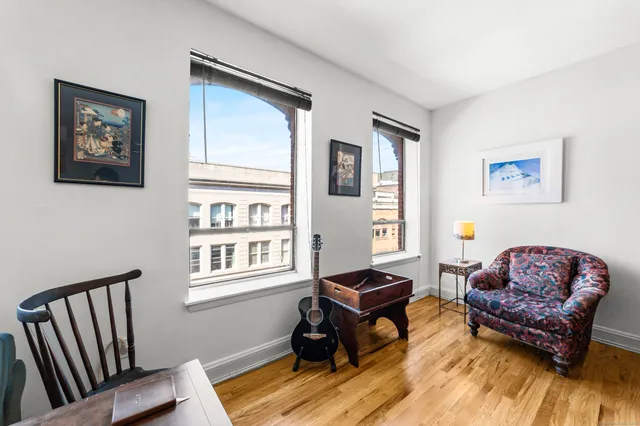 a living room with furniture and a window