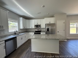 390 Summerhill Road Fayetteville, NC 28303 - Photo 6 of 27 a kitchen with stainless steel appliances granite countertop a sink stove and microwave