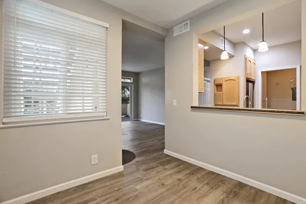 a kitchen with stainless steel appliances granite countertop a sink a stove and a microwave
