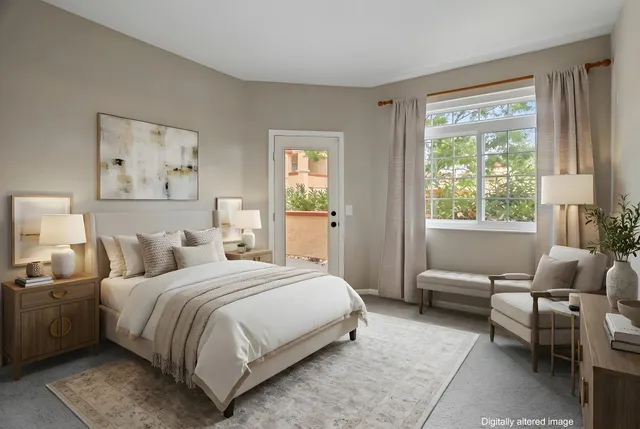 a bedroom with a bed and a couch