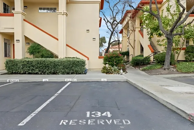 a view of a street with a building in the background