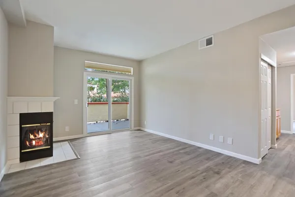 a living room with furniture a fireplace and a fireplace