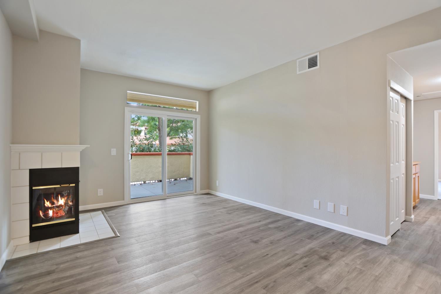 6986 Stagecoach Road, Unit B Dublin, CA 94568 - Photo 10 of 28 a view of an empty room with window and fire place