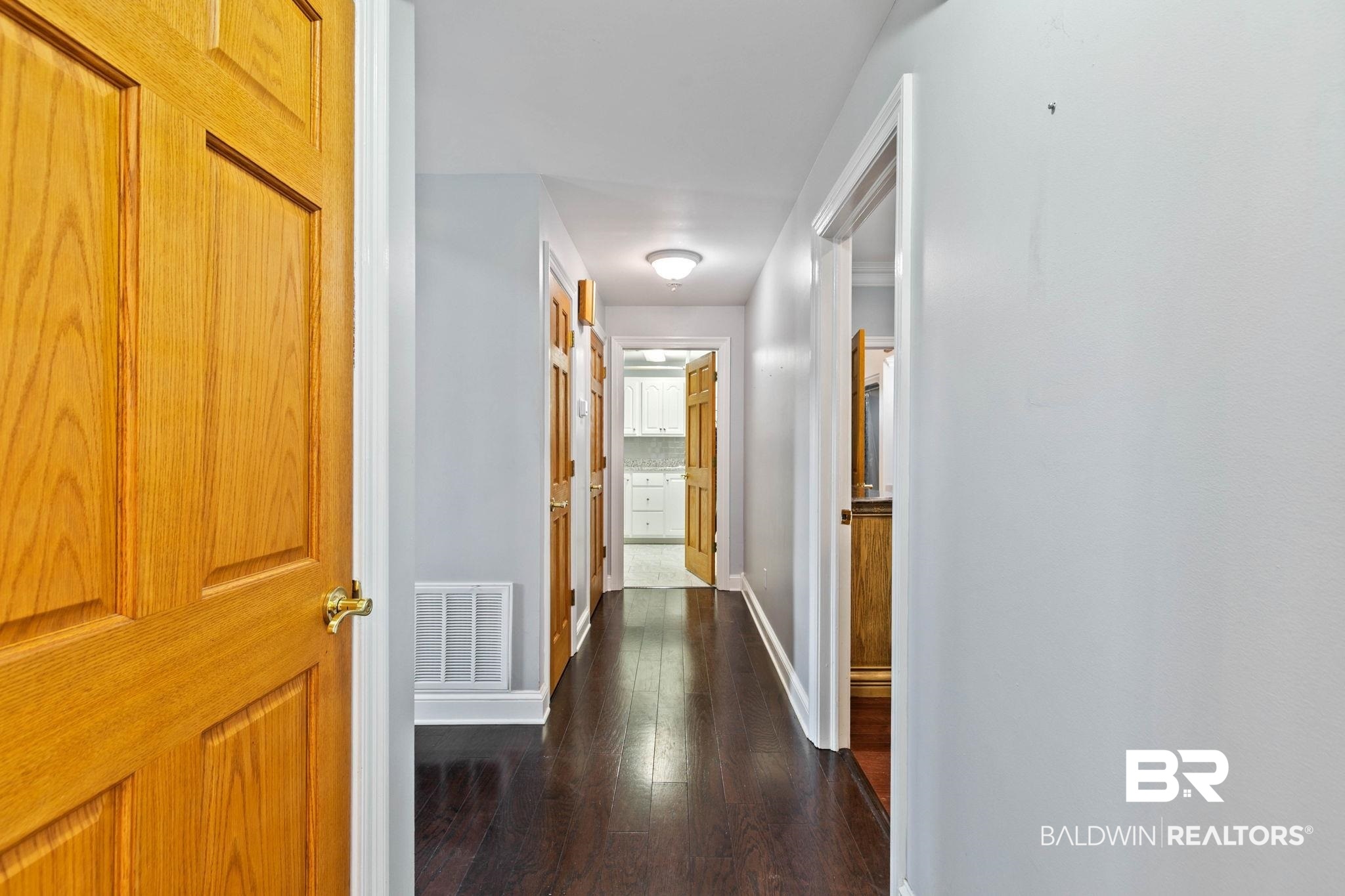 2 Speckle Trout Route Daphne, AL 36527 - Photo 22 of 61 Hallway featuring baseboards and dark wood-style flooring
