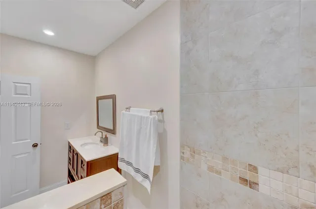 a view of room with window and ceiling fan