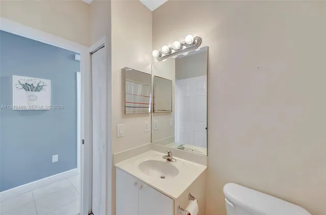 a view of a small space with wooden floor and a window