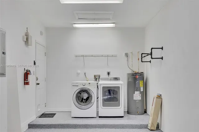 a bathroom with a tub and shower