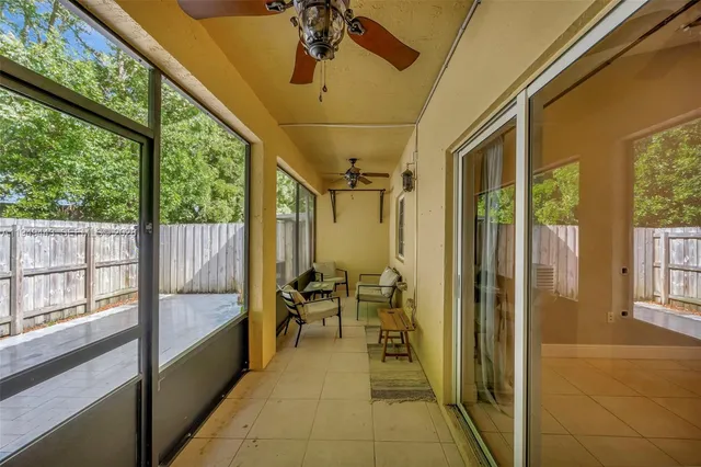 a reading room with furniture and a large window