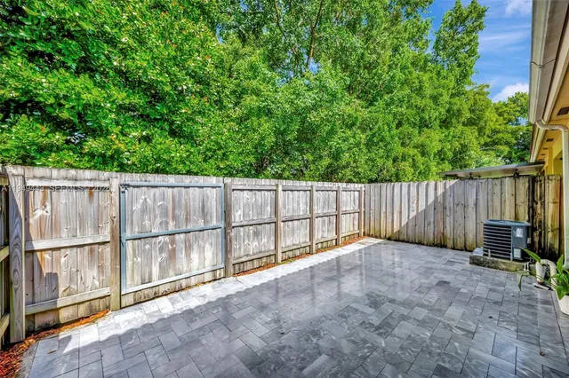 a view of a livingroom with furniture and lounge chair