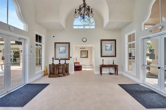 a view of a livingroom with furniture and a large window
