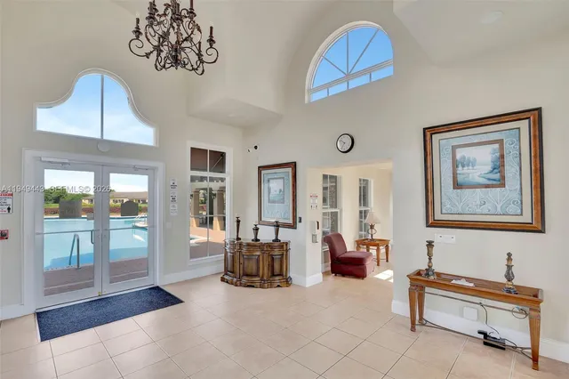 a living room with lots of furniture and a view of bedroom
