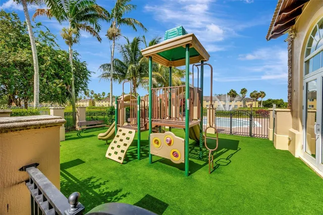 a view of swimming pool with outdoor seating and city view