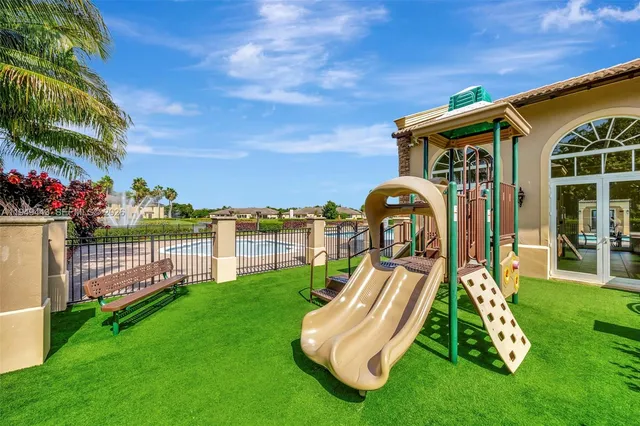 an aerial view of a house with a lake view