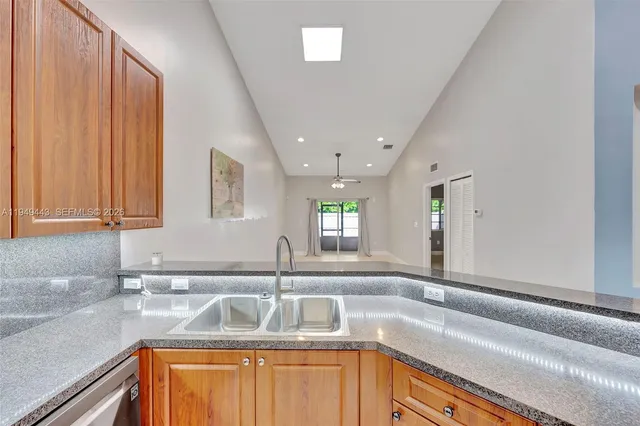 a kitchen with a sink and a window