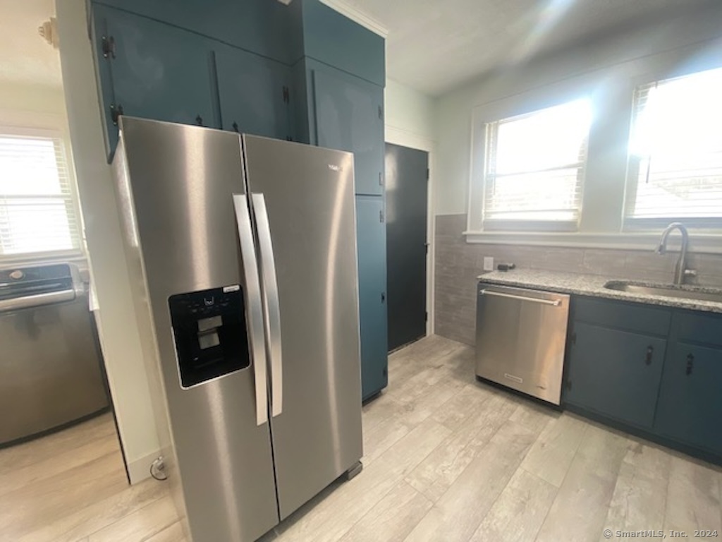 279 Wakelee Avenue Ansonia, CT 06401 - Photo 3 of 23 a view of a kitchen with refrigerator stove and sink