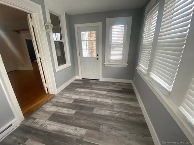 a view of an empty room with a fireplace