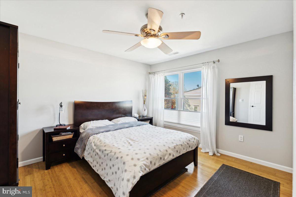 262 Arcadia Shores Circle Odenton, MD 21113 - Photo 13 of 37 a bedroom with a bed and a chandelier