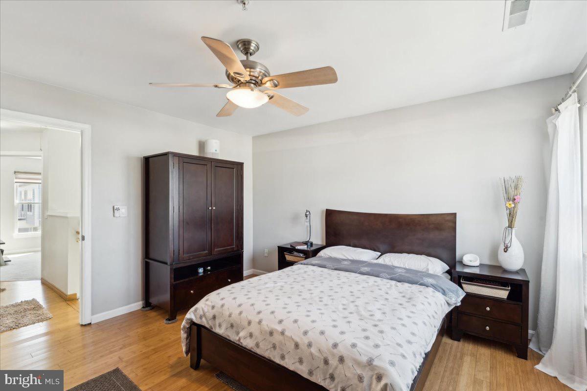 262 Arcadia Shores Circle Odenton, MD 21113 - Photo 14 of 37 a bedroom with a bed and a flat screen tv