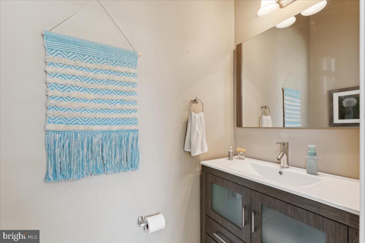 262 Arcadia Shores Circle Odenton, MD 21113 - Photo 16 of 37 a bathroom with a sink vanity and a mirror