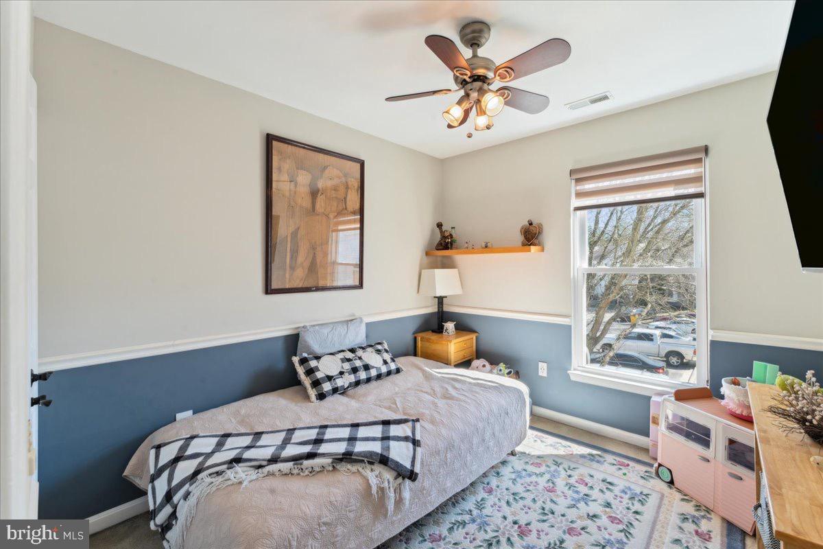 262 Arcadia Shores Circle Odenton, MD 21113 - Photo 18 of 37 a bedroom with a bed and wooden floor