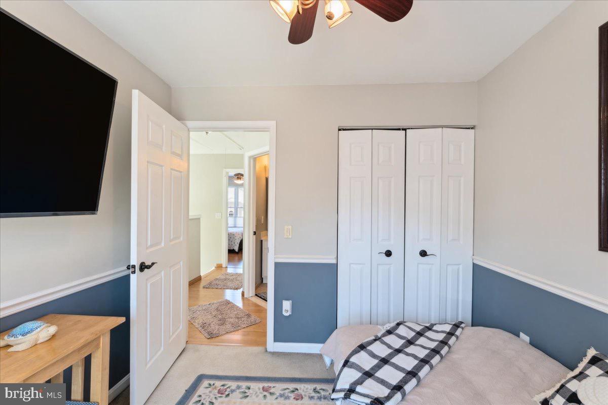 262 Arcadia Shores Circle Odenton, MD 21113 - Photo 19 of 37 a bedroom with a bed and a flat screen tv