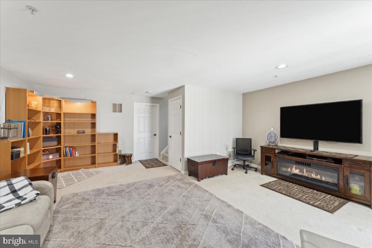 262 Arcadia Shores Circle Odenton, MD 21113 - Photo 24 of 37 a living room with furniture and a flat screen tv