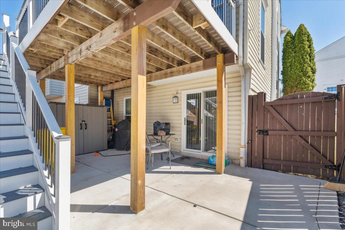 262 Arcadia Shores Circle Odenton, MD 21113 - Photo 27 of 37 a view of a porch with a table and chairs