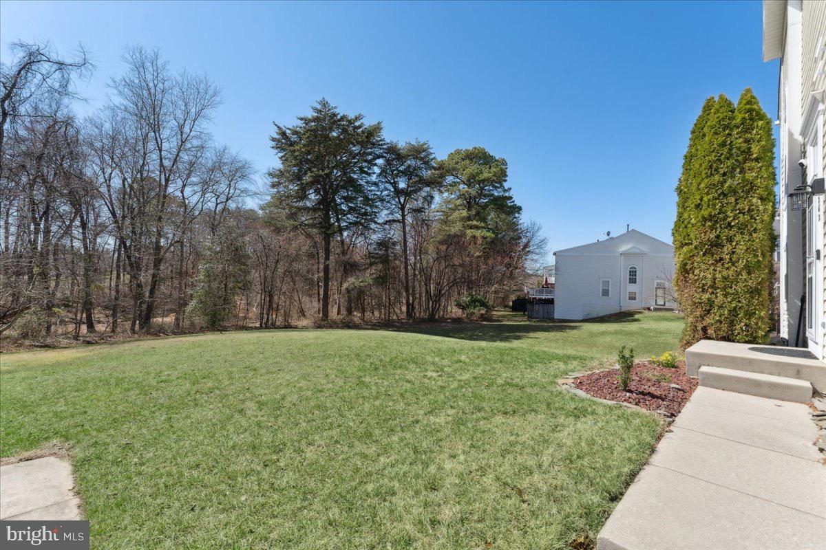 262 Arcadia Shores Circle Odenton, MD 21113 - Photo 30 of 37 a view of a street with a house in the background