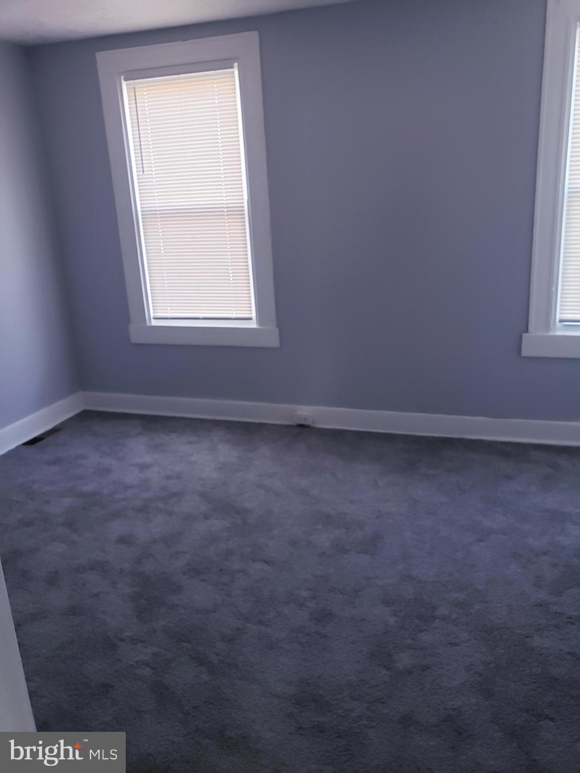 3441 Elmora Avenue Baltimore, MD 21213 - Photo 6 of 10 an empty room with a window