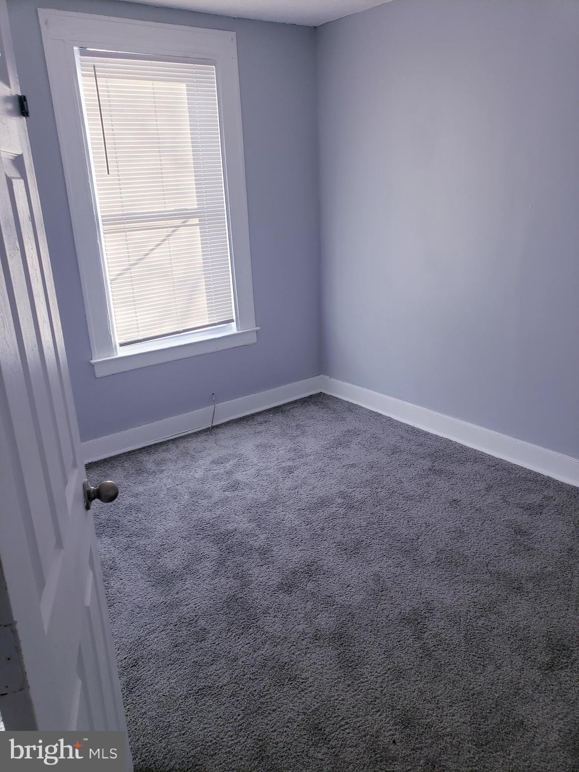 3441 Elmora Avenue Baltimore, MD 21213 - Photo 10 of 10 an empty room with a window