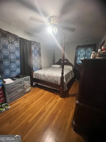 a bedroom with double bed and a window