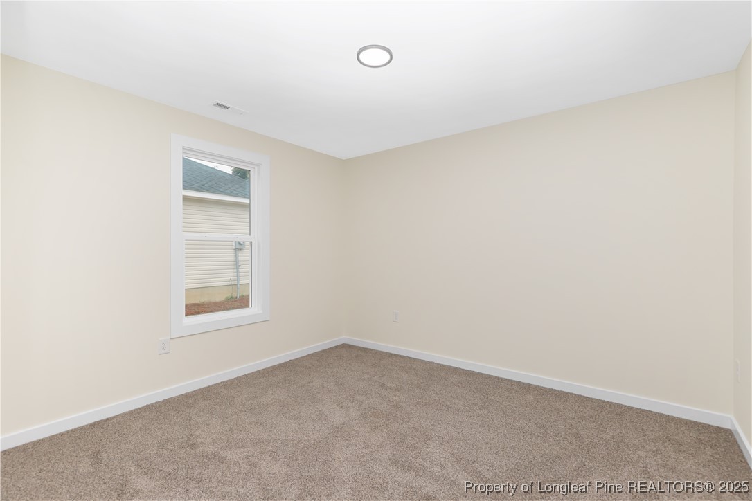229 East Washington Street Coats, NC 27521 - Photo 16 of 24 an empty room with a window
