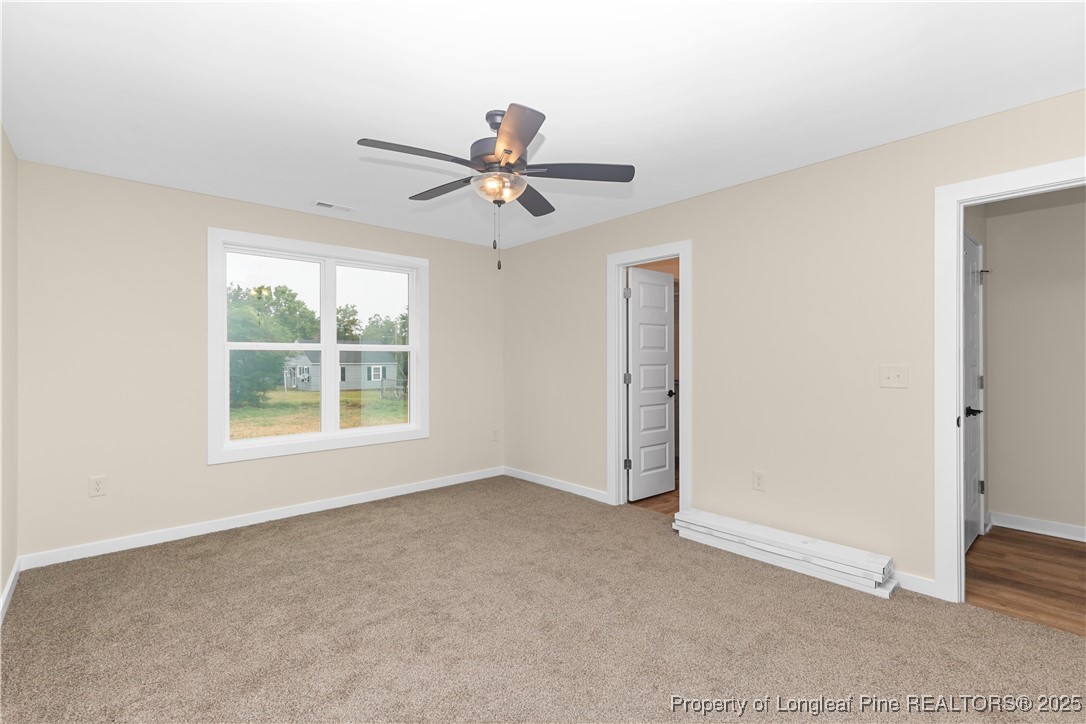 229 East Washington Street Coats, NC 27521 - Photo 18 of 24 a view of an empty room with a window