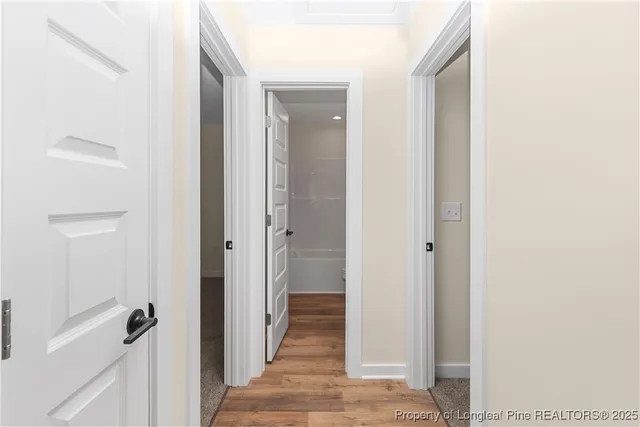 a view of a bathroom from a hallway