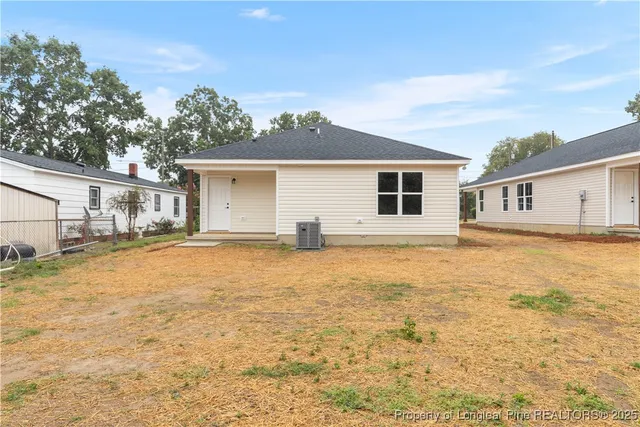 a house with trees in the background