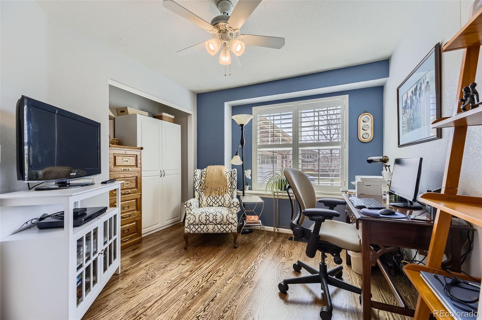 20040 East Doane Drive Aurora, CO 80013 - Photo 11 of 28 a living room with furniture and a flat screen tv