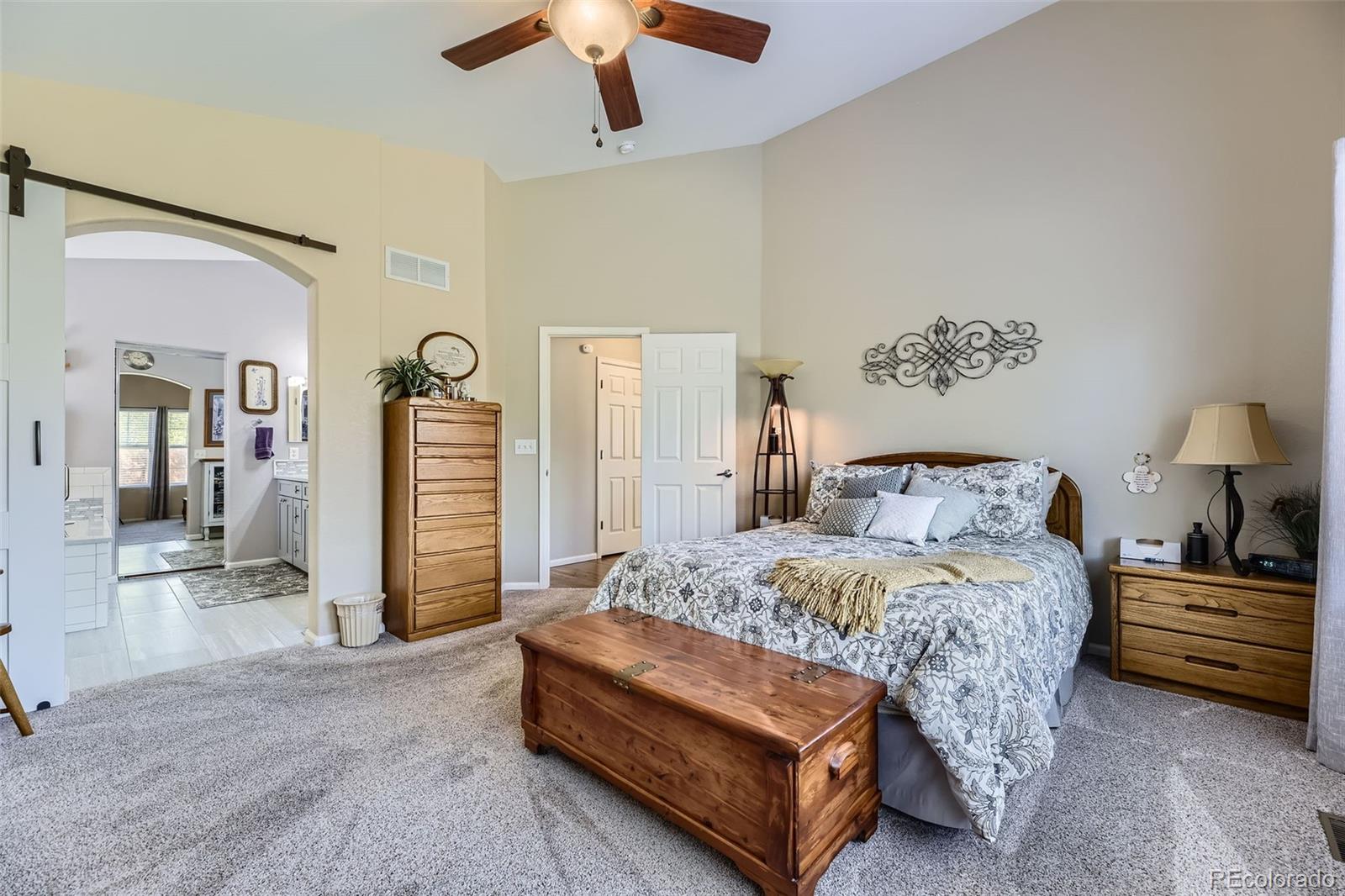 20040 East Doane Drive Aurora, CO 80013 - Photo 14 of 28 a bedroom with a bed and ceiling fan