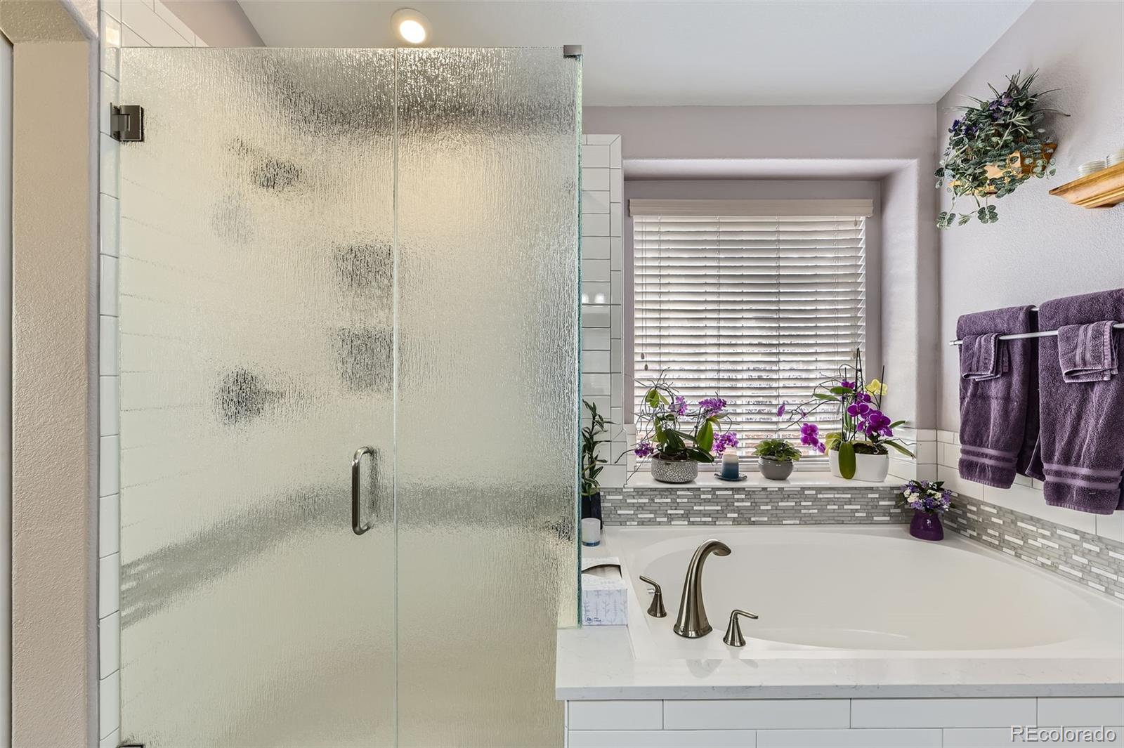 20040 East Doane Drive Aurora, CO 80013 - Photo 16 of 28 a bathroom with a faucet a sink and a window