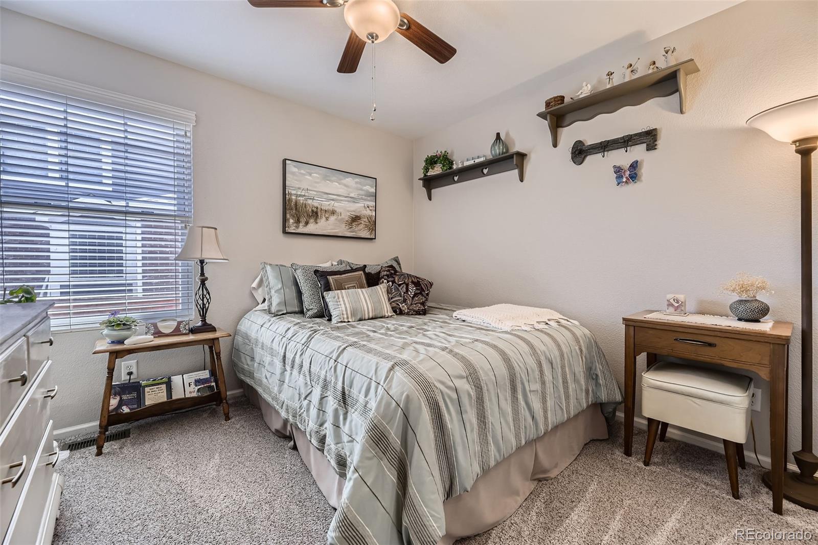 20040 East Doane Drive Aurora, CO 80013 - Photo 18 of 28 a bedroom with a bed and a desk
