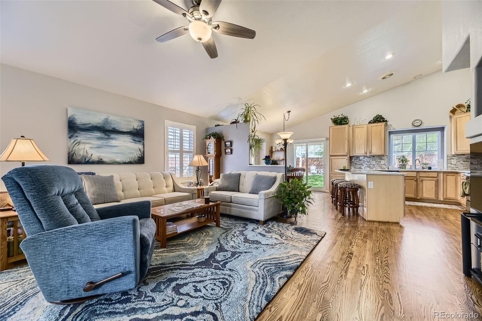 20040 East Doane Drive Aurora, CO 80013 - Photo 2 of 28 a living room with furniture and wooden floor