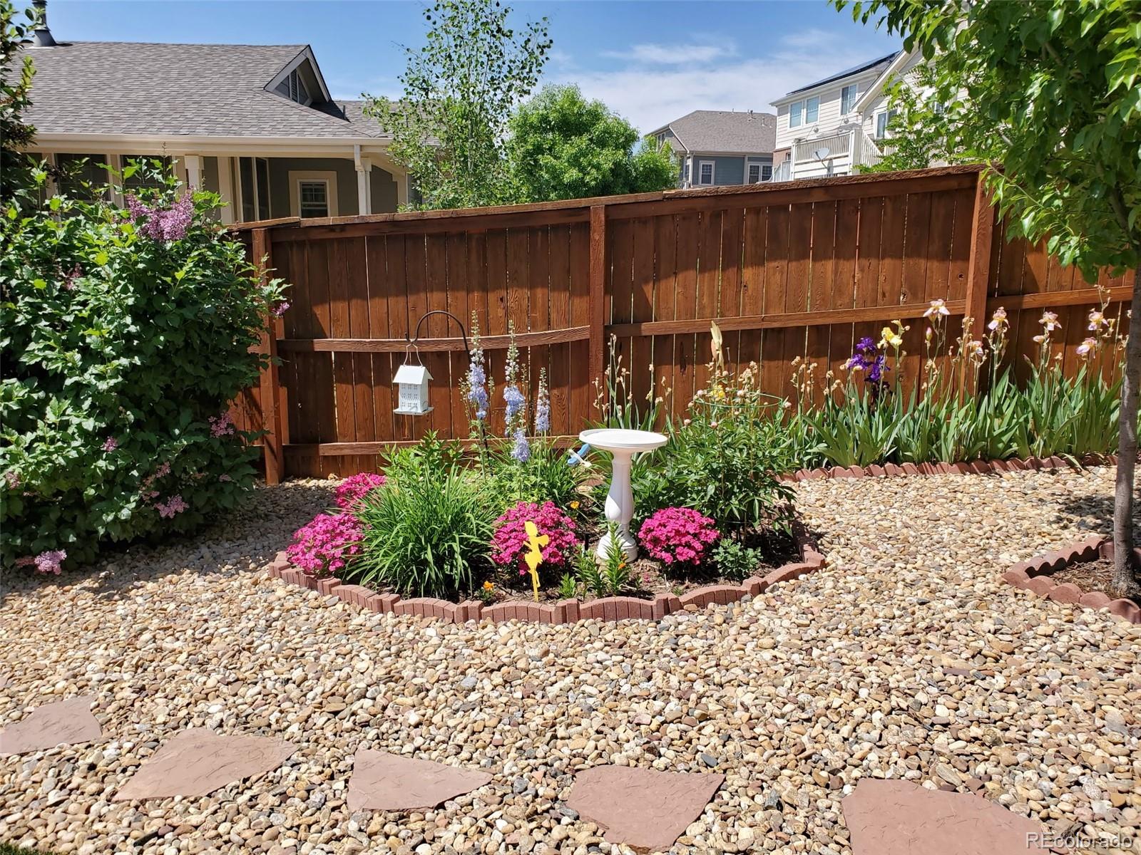 20040 East Doane Drive Aurora, CO 80013 - Photo 23 of 28 a view of a garden with flowers