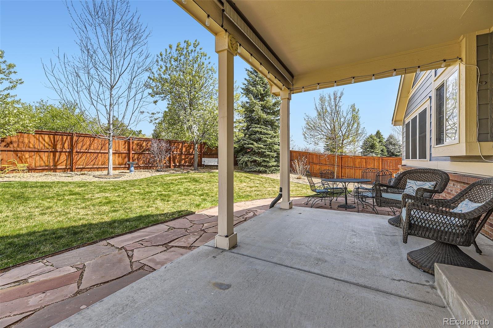 20040 East Doane Drive Aurora, CO 80013 - Photo 24 of 28 a view of yard with patio