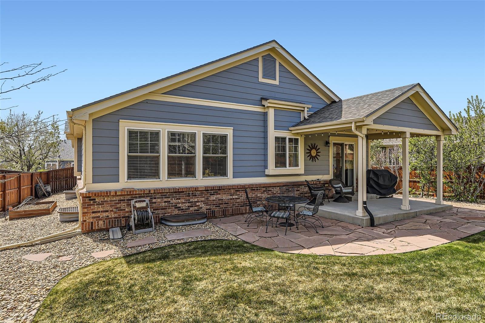 20040 East Doane Drive Aurora, CO 80013 - Photo 26 of 28 a view of a house with swimming pool and sitting area