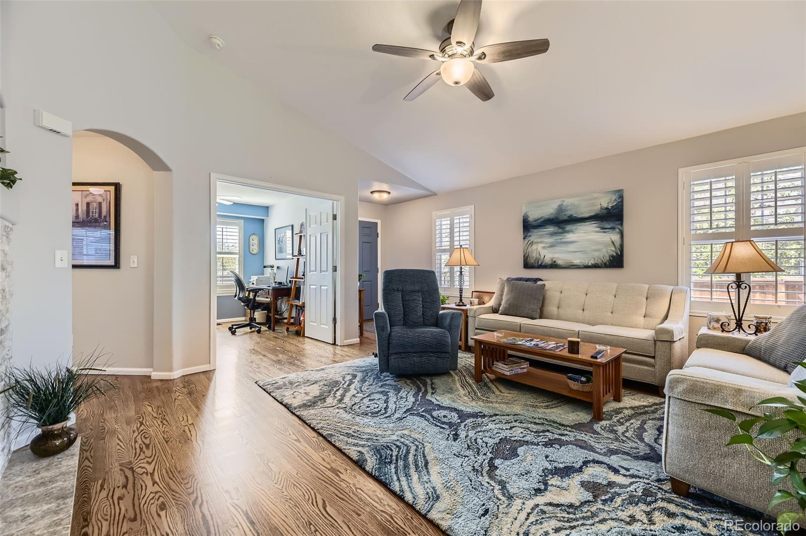 20040 East Doane Drive Aurora, CO 80013 - Photo 3 of 28 a living room with furniture and wooden floor