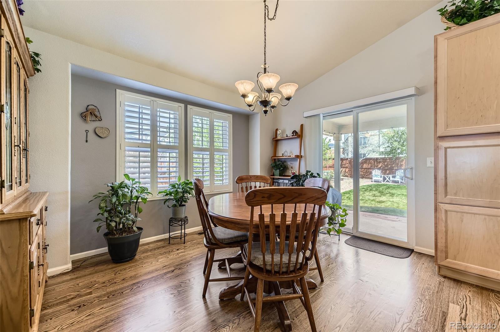 20040 East Doane Drive Aurora, CO 80013 - Photo 9 of 28 a view of a dining room with furniture window and wooden floor