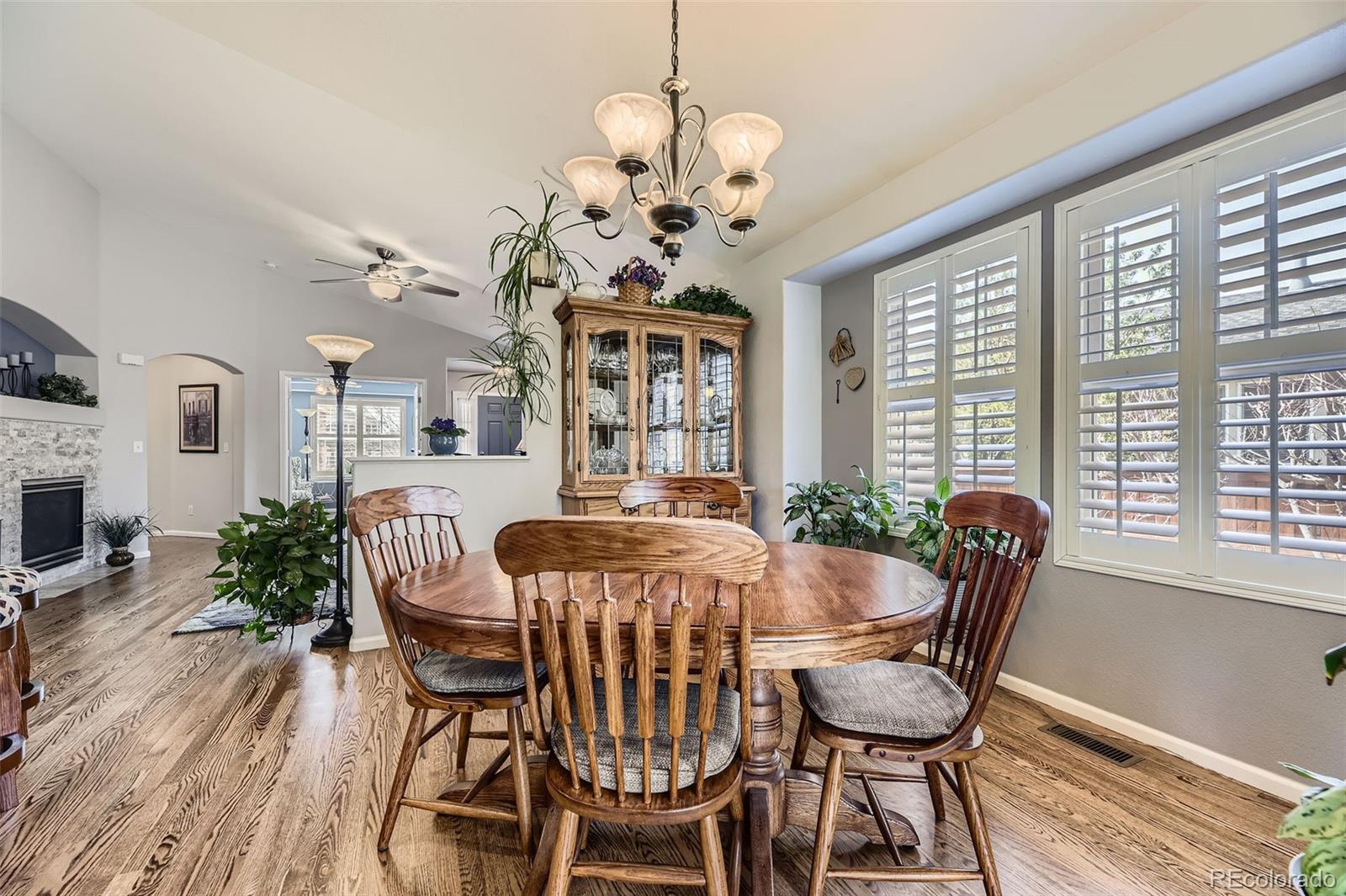 20040 East Doane Drive Aurora, CO 80013 - Photo 10 of 28 a view of a dining room with furniture window and wooden floor